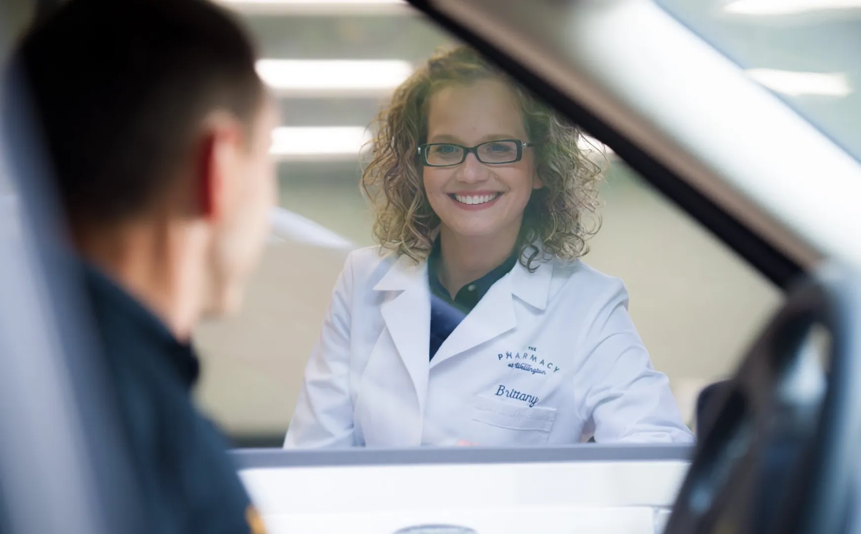 Customer service at pharmacy drive-thru window