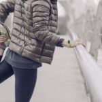 Runner warms up on a bridge