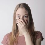 Surprised woman with long hair