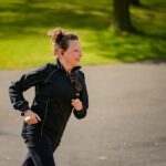 Smiling woman running outdoors