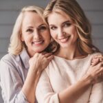 Two women sharing a warm hug