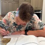 Student taking notes by hand