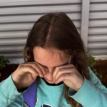 Girl rubbing eyes