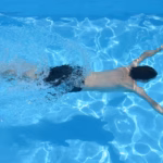 Swimmer in blue pool
