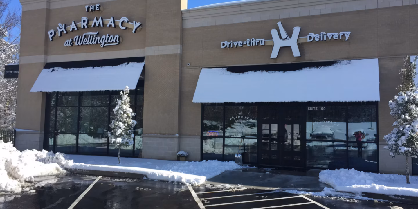 Pharmacy building with snow-covered awnings